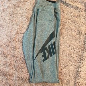 Gray Nike leggings with black lettering